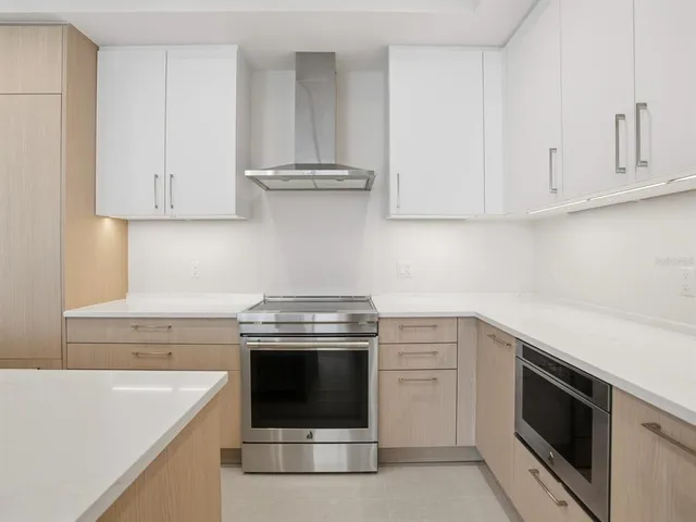 an empty room with a large window with outer view