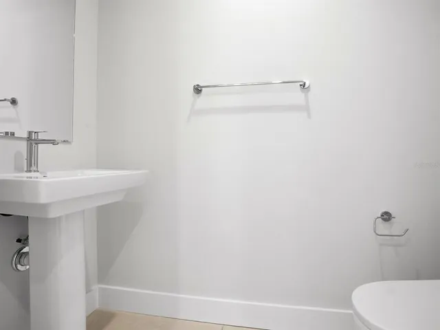 an empty room with closet and a window