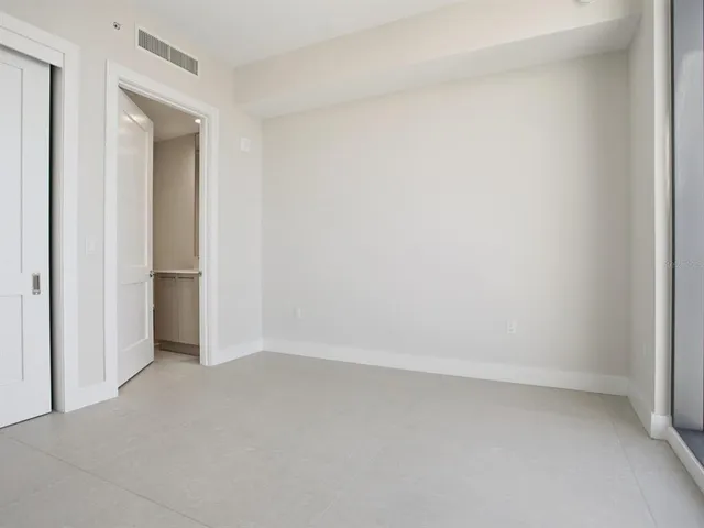 a view of a swimming pool with outdoor seating