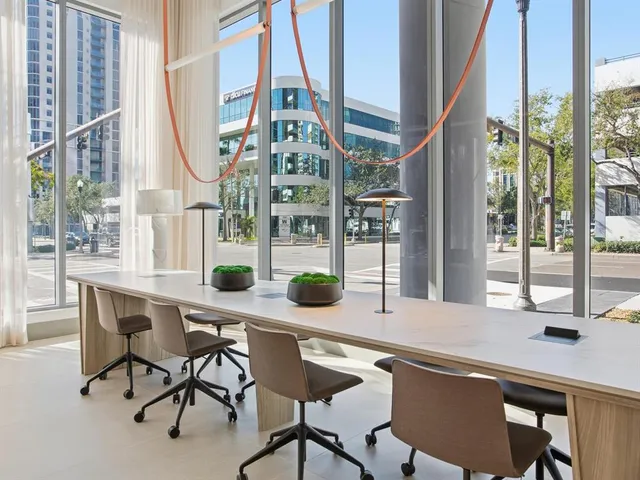 a kitchen with a sink and large cabinets