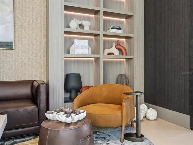 a kitchen with stainless steel appliances granite countertop a sink and a white cabinets