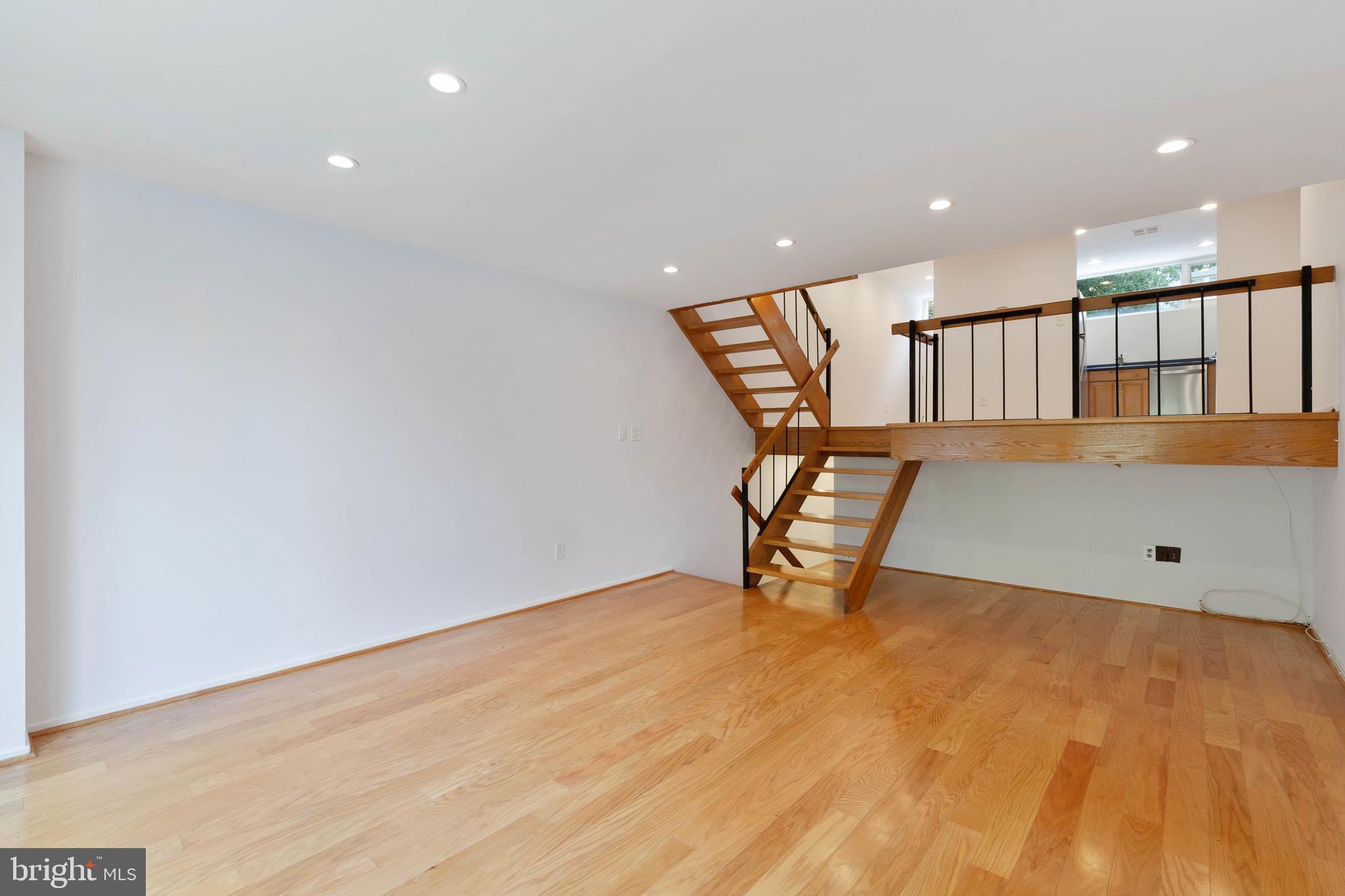 11520 Hickory Cluster Reston, VA 20190 - Photo 10 of 34 Living room looking up to dining and front hall