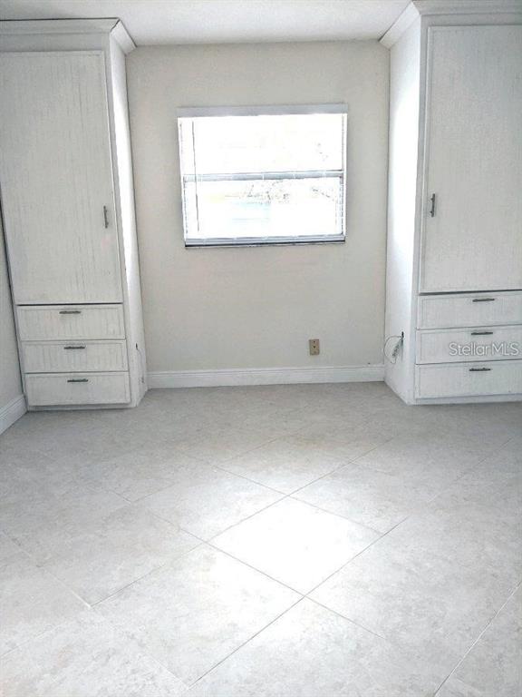 201 Bedford Trail, Unit F127 Sun City Center, FL 33573 - Photo 12 of 15 an empty room with windows