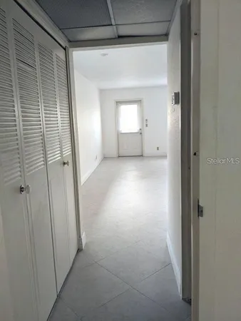 a view of an empty room with a window