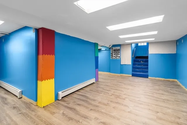 a view of an empty room with a bathroom