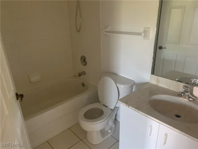 a bathroom with a toilet a sink and bathtub
