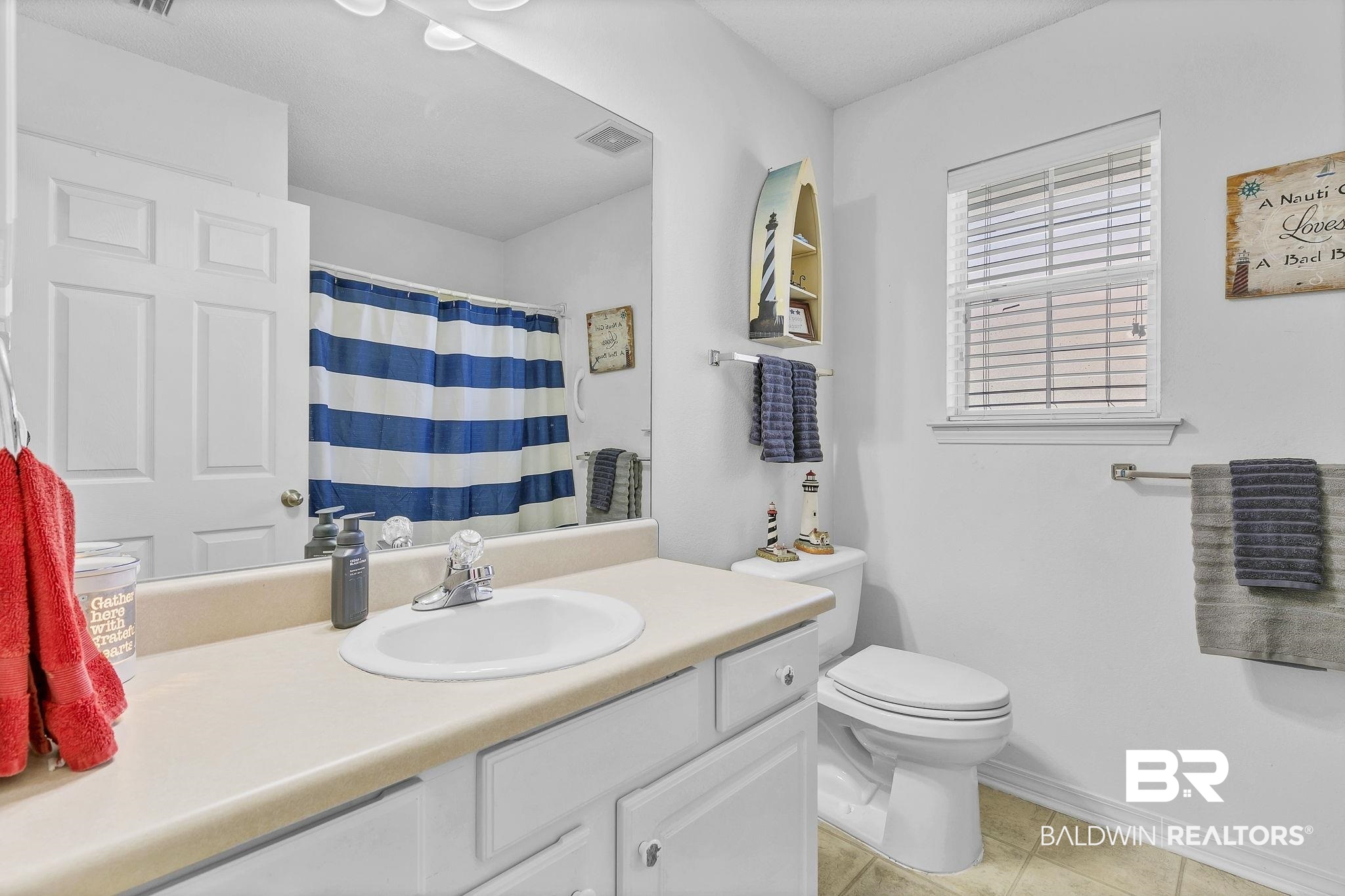 16358 Tempest Drive Foley, AL 36535 - Photo 31 of 46 Bathroom with tile patterned floors, toilet, baseboards, visible vents, and vanity