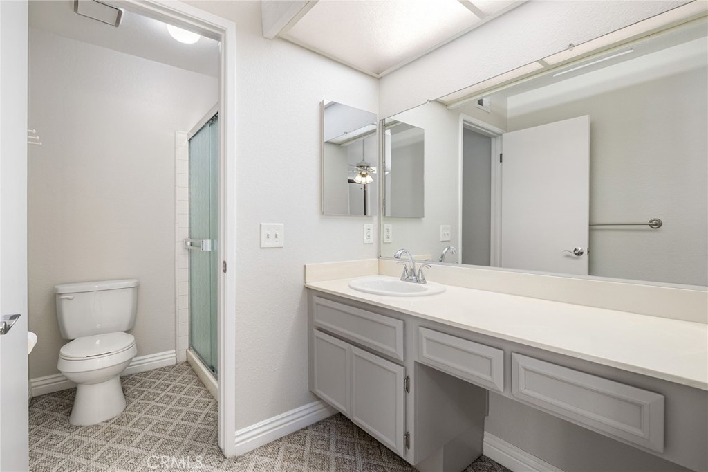 711 Santa Rosa San Dimas, CA 91773 - Photo 20 of 32 a spacious bathroom with a sink a toilet a shower and a mirror
