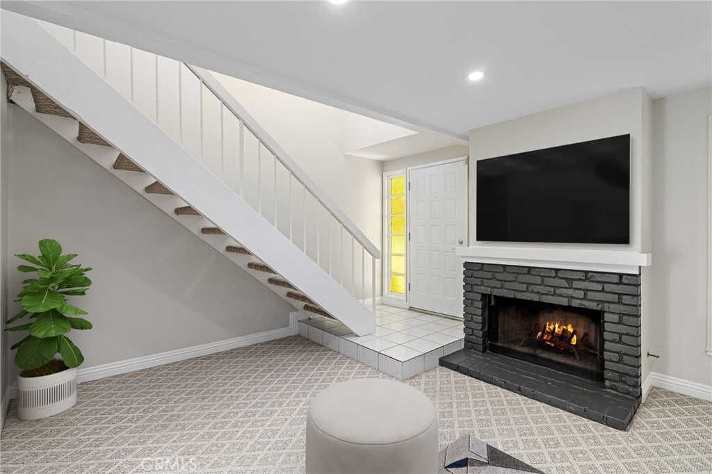 711 Santa Rosa San Dimas, CA 91773 - Photo 3 of 32 a living room with furniture and a fireplace