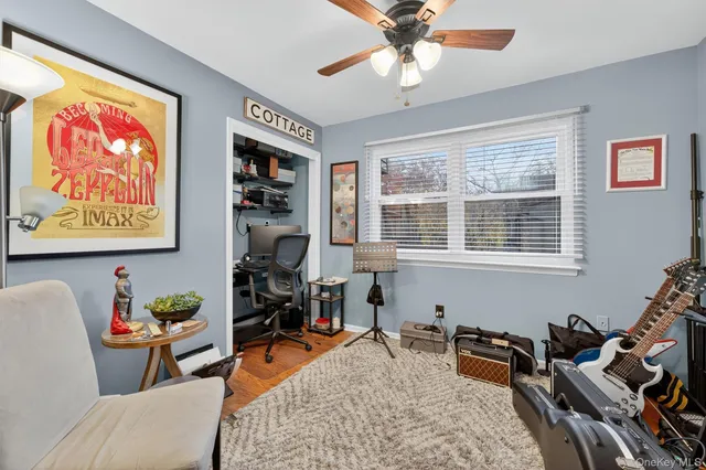 a living room with furniture a chandelier and a flat screen tv