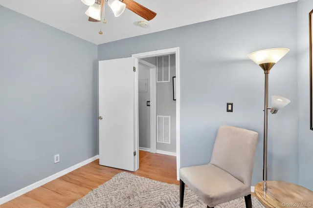 a view of room with furniture and wooden floor
