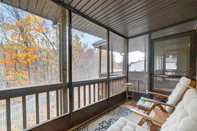 a view of a patio with wooden floor