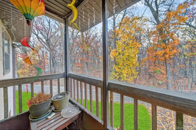 a view of a balcony with furniture