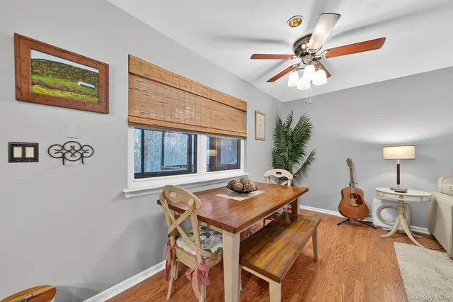 a view of a workspace with furniture and a chandelier