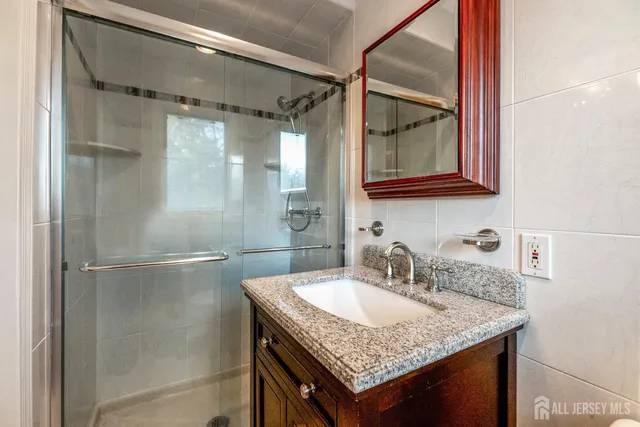 a bedroom with a bed and a chair