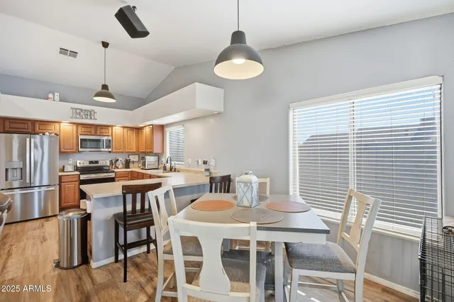 a view of a dining room with furniture window and wooden floor