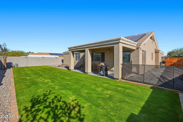 a view of a back yard of the house