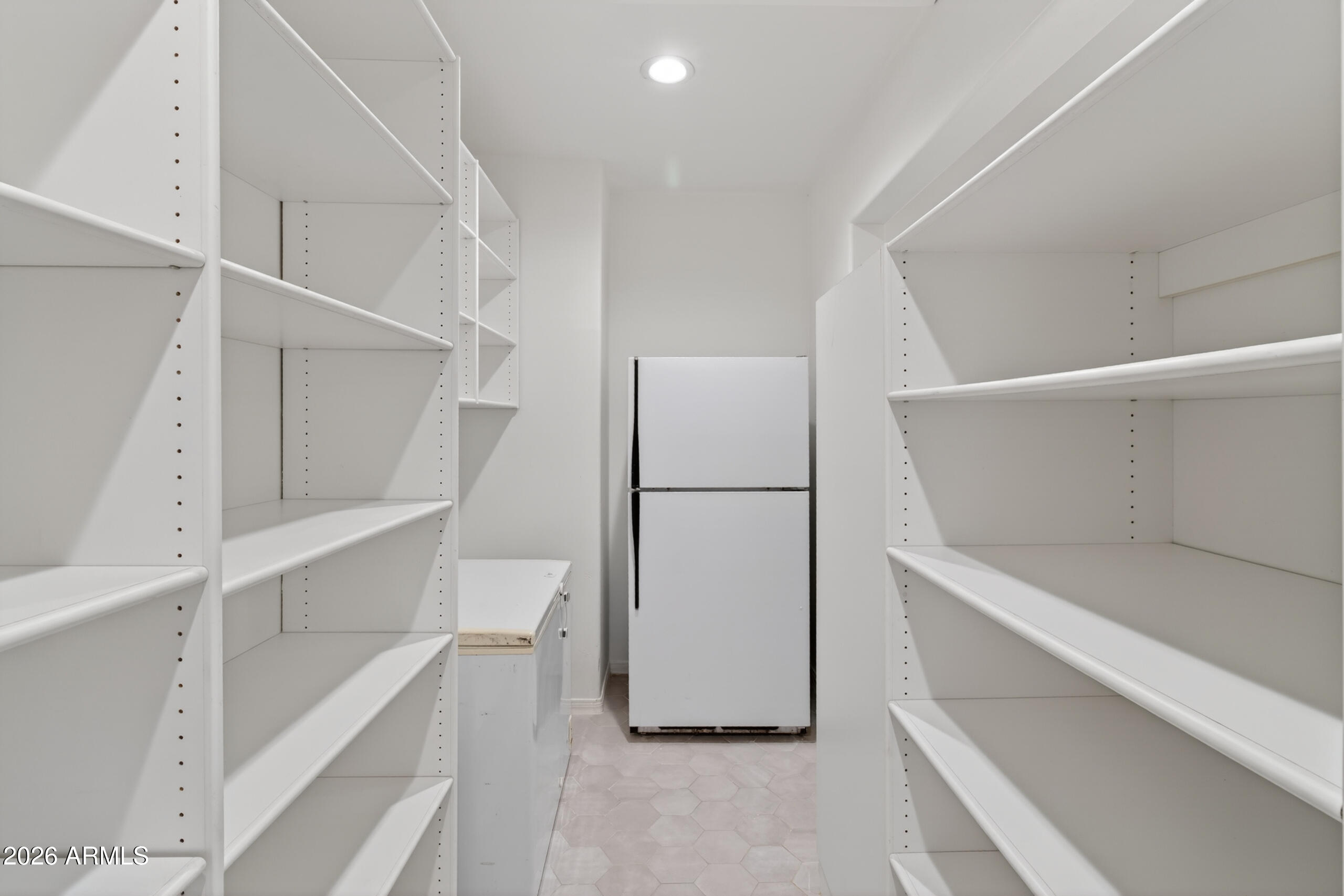 2677 East Queen Creek Road Gilbert, AZ 85297 - Photo 37 of 128 a view of walk in closet with empty racks