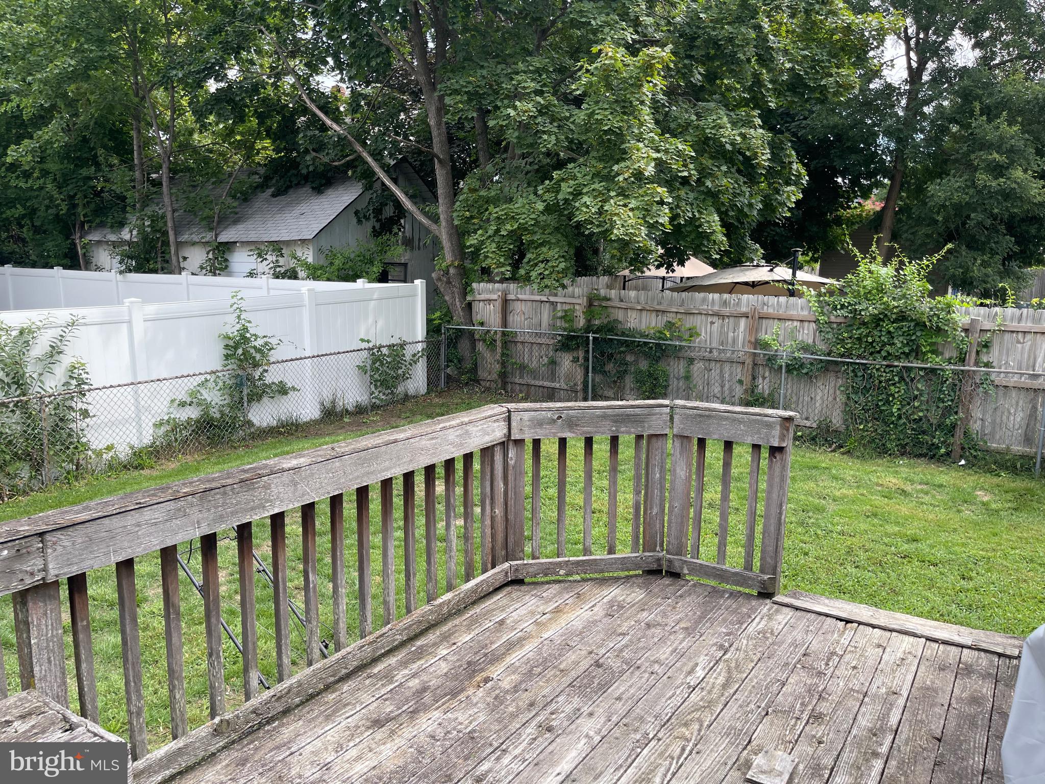 121 Spring Garden Street Riverside, NJ 08075 - Photo 6 of 26 a view of a deck with a yard