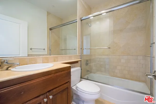 a bathroom with a sink a toilet and a bathtub