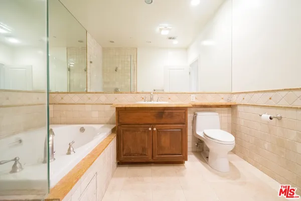 a bathroom with a bathtub sink and toilet