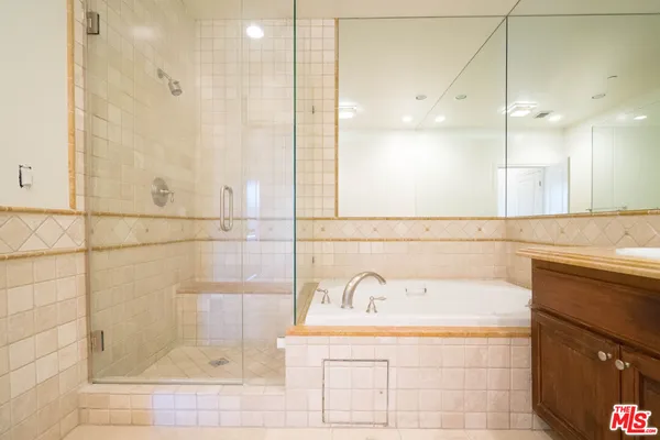 a bathroom with a bathtub and a sink