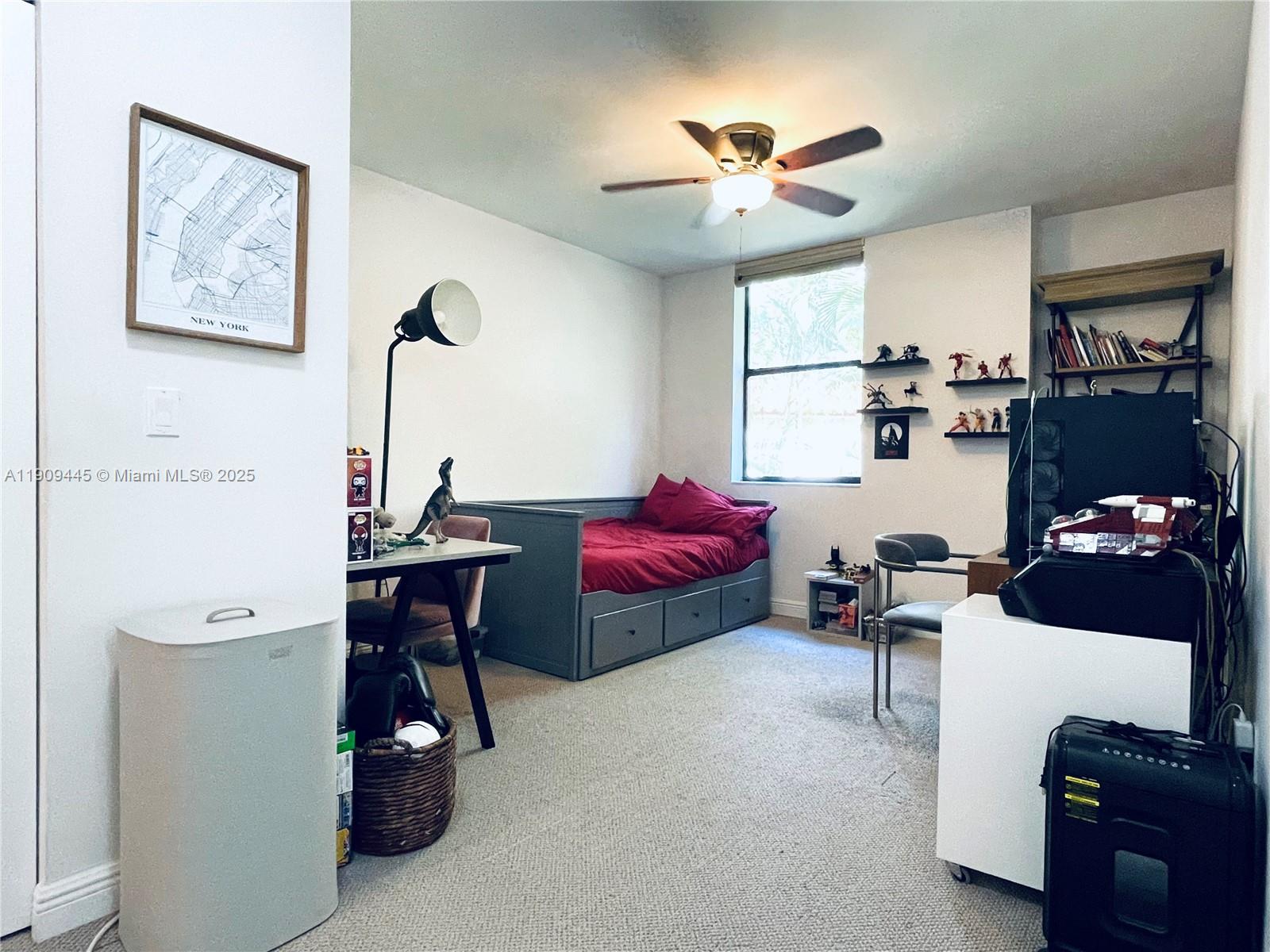 888 Douglas Road, Unit 119 Coral Gables, FL 33134 - Photo 21 of 36 a living room with furniture and a chandelier