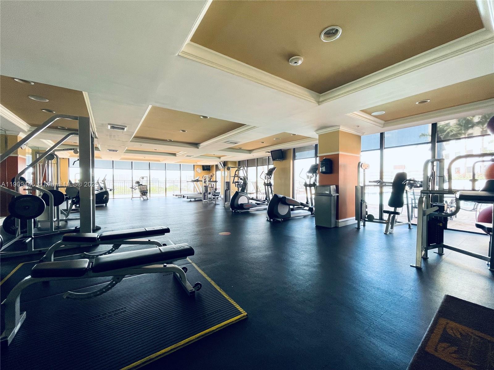 888 Douglas Road, Unit 119 Coral Gables, FL 33134 - Photo 32 of 36 a view of a studio with wooden floor