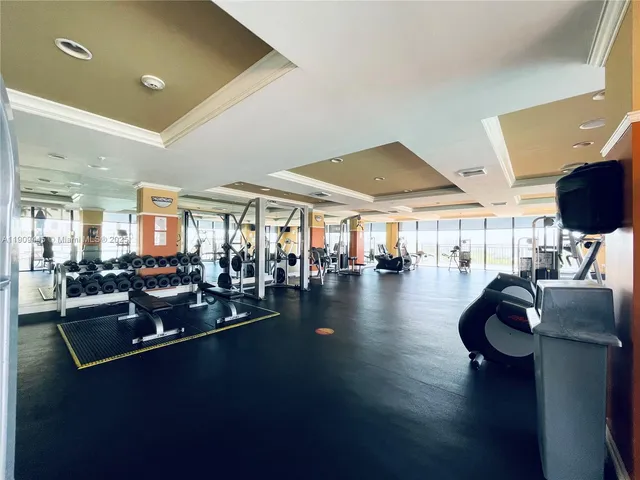 a lobby with furniture and floor to ceiling window