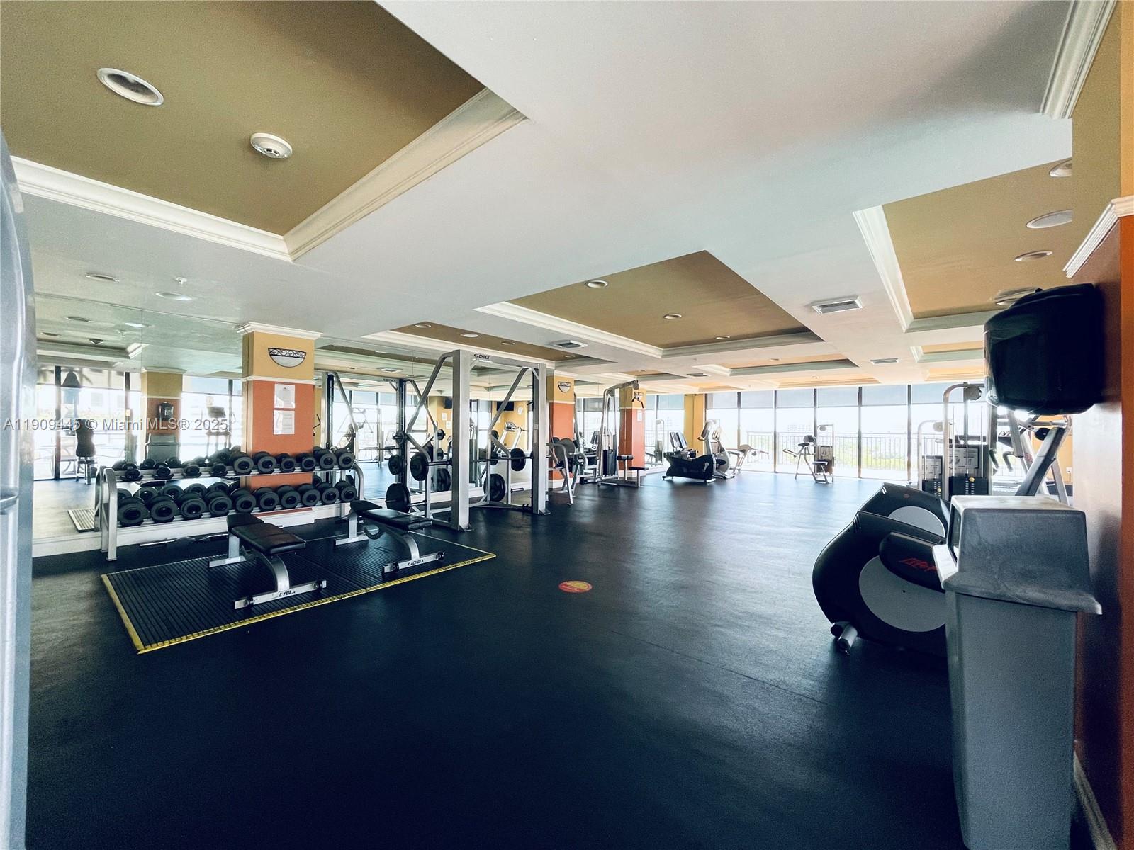 888 Douglas Road, Unit 119 Coral Gables, FL 33134 - Photo 33 of 36 a lobby with furniture and floor to ceiling window