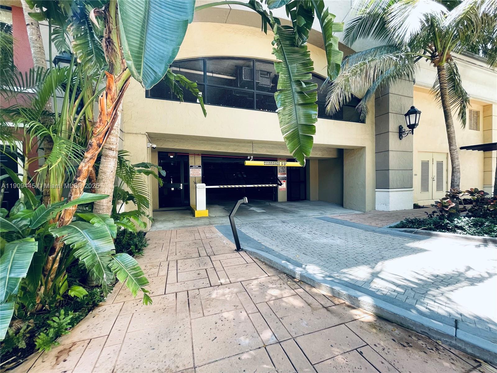 888 Douglas Road, Unit 119 Coral Gables, FL 33134 - Photo 34 of 36 a view of a house with a patio