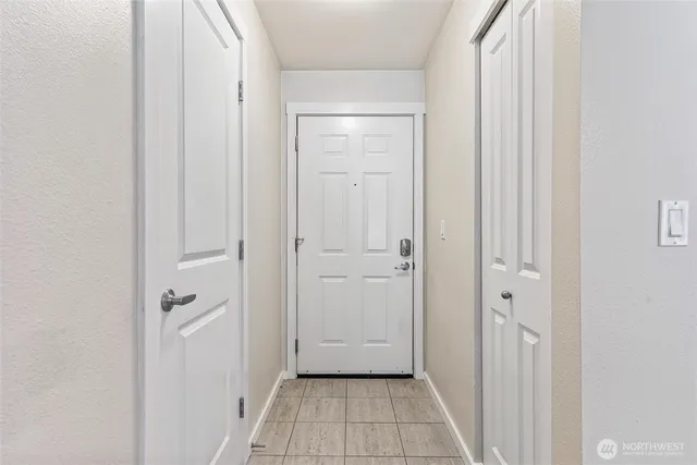 a view of a chair and table in the back yard