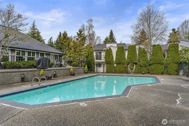 a view of a street with a car park in front of the house