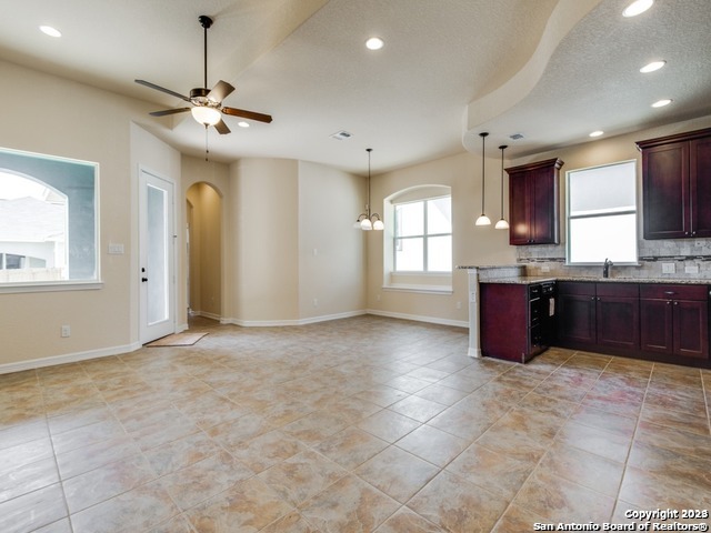 a large kitchen with a sink and dishwasher