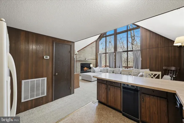 a bedroom with a bed garage and window