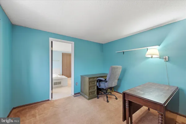 a workspace with furniture and window