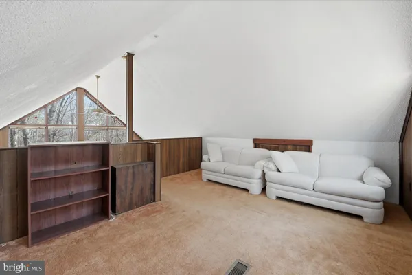 a view of balcony with wooden floor and fence