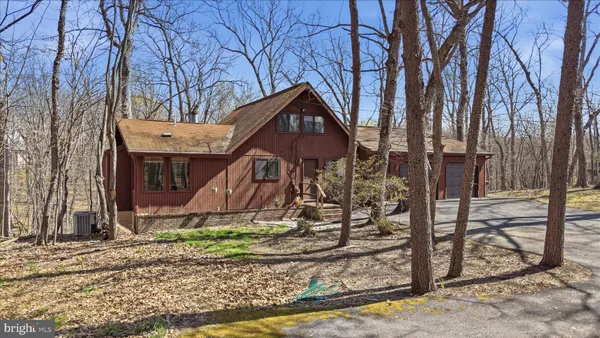 a house with trees in the background
