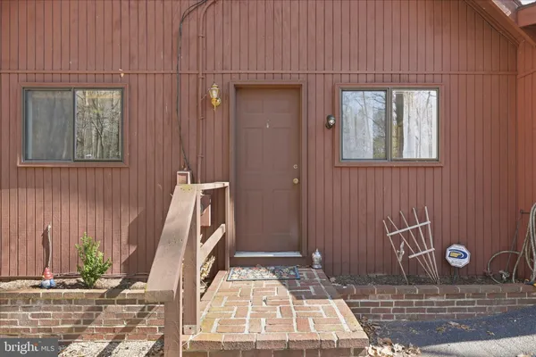 a bathroom with a glass door shower
