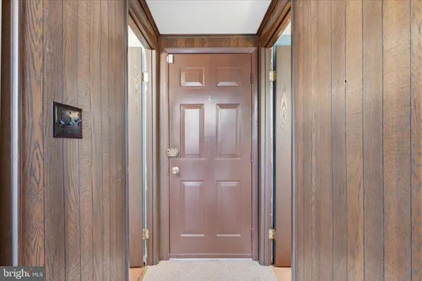 a view of a bathroom from the hallway