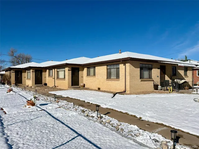 a front view of a house with yard