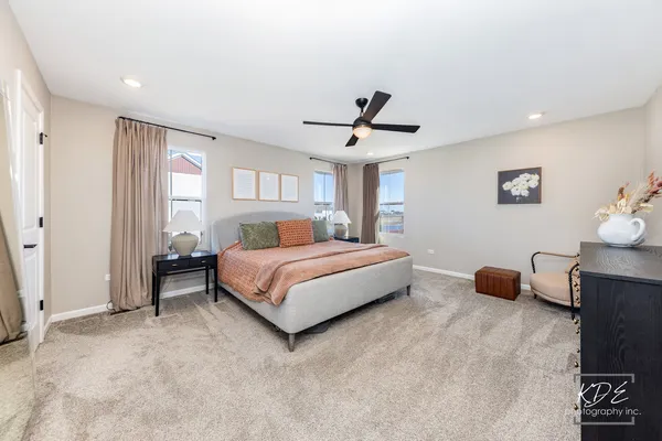 a bedroom with a bed and a couch