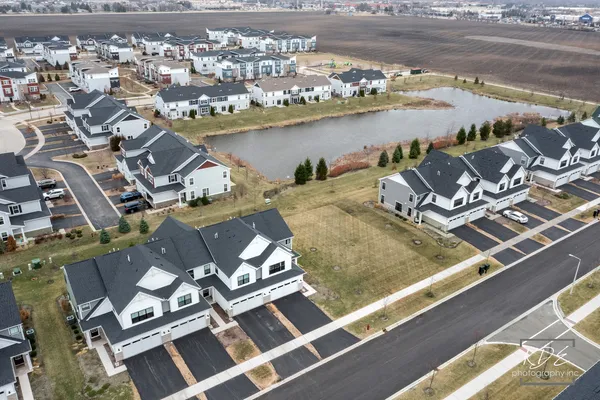 an aerial view of a house with lake view