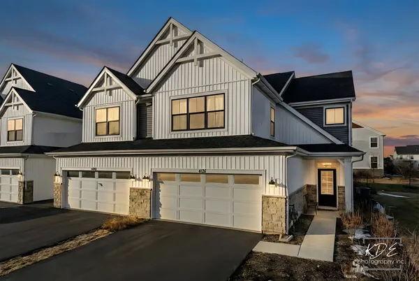 a front view of a house with parking