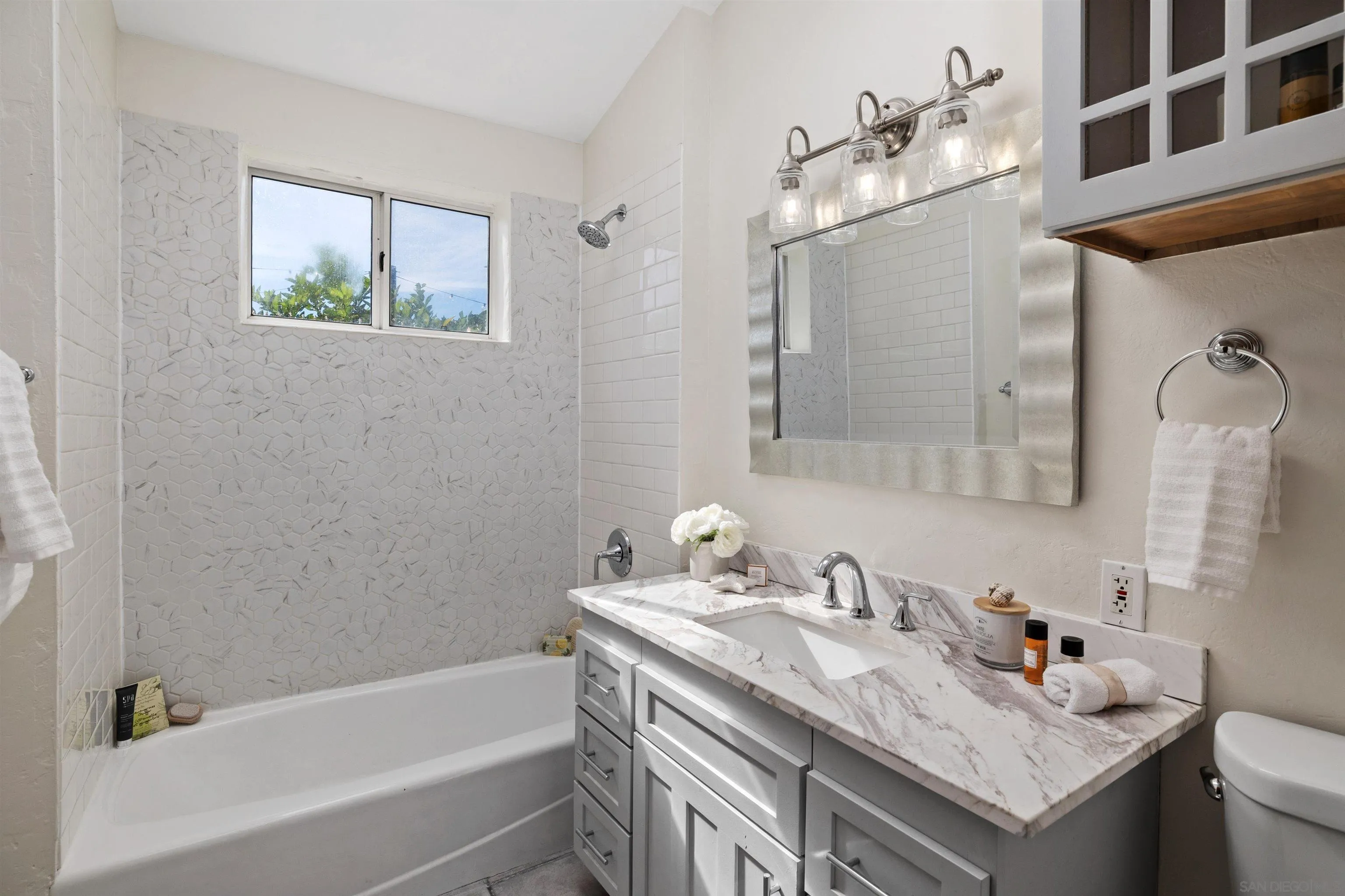 1564 Reed Avenue San Diego, CA 92109 - Photo 15 of 39 Stylishly Renovated Bathroom with Marble Countertops & Custom Tile Shower