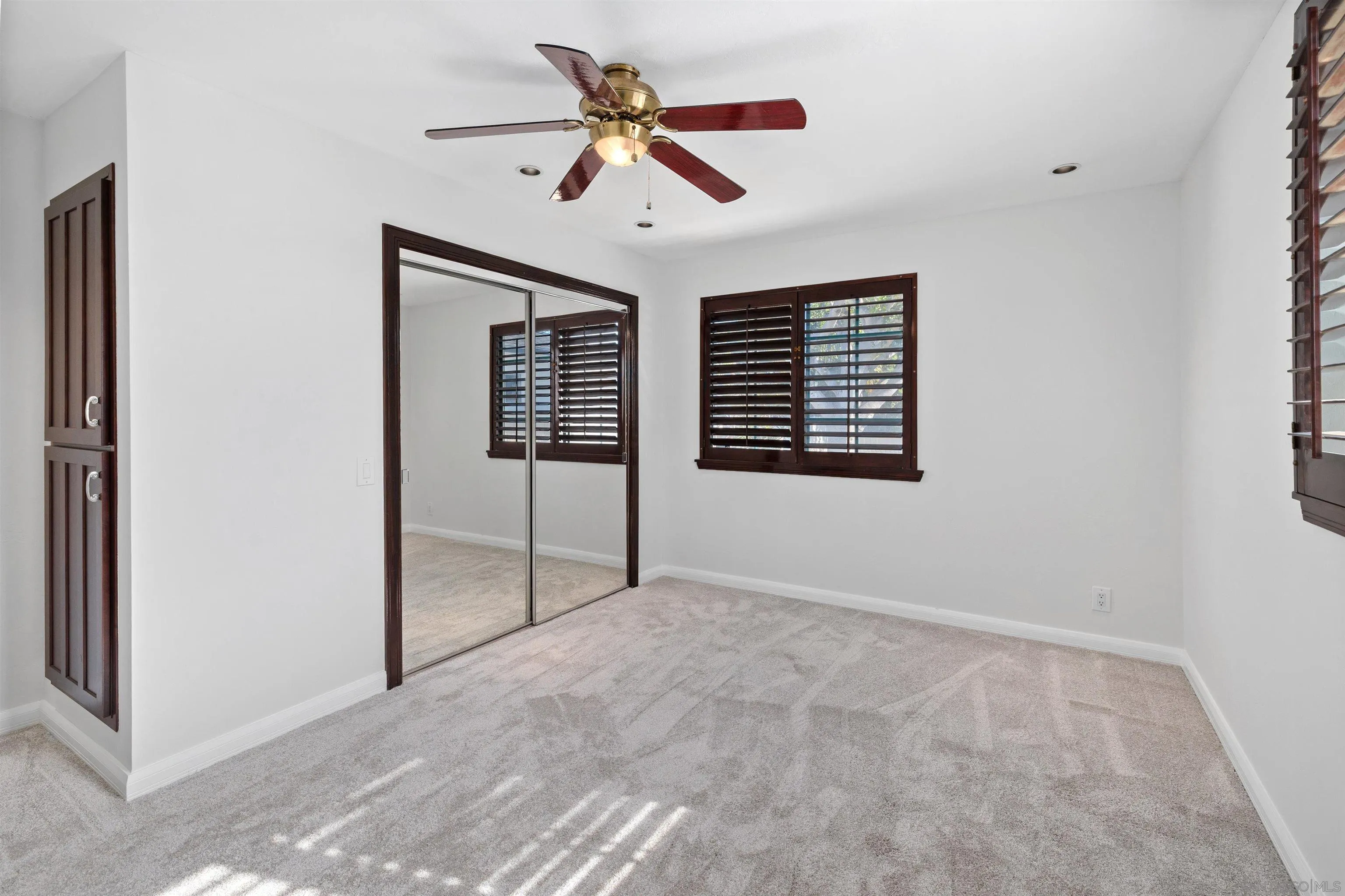1564 Reed Avenue San Diego, CA 92109 - Photo 17 of 39 Generous Downstairs Bedroom with Oversized Closet & Custom Built-Ins