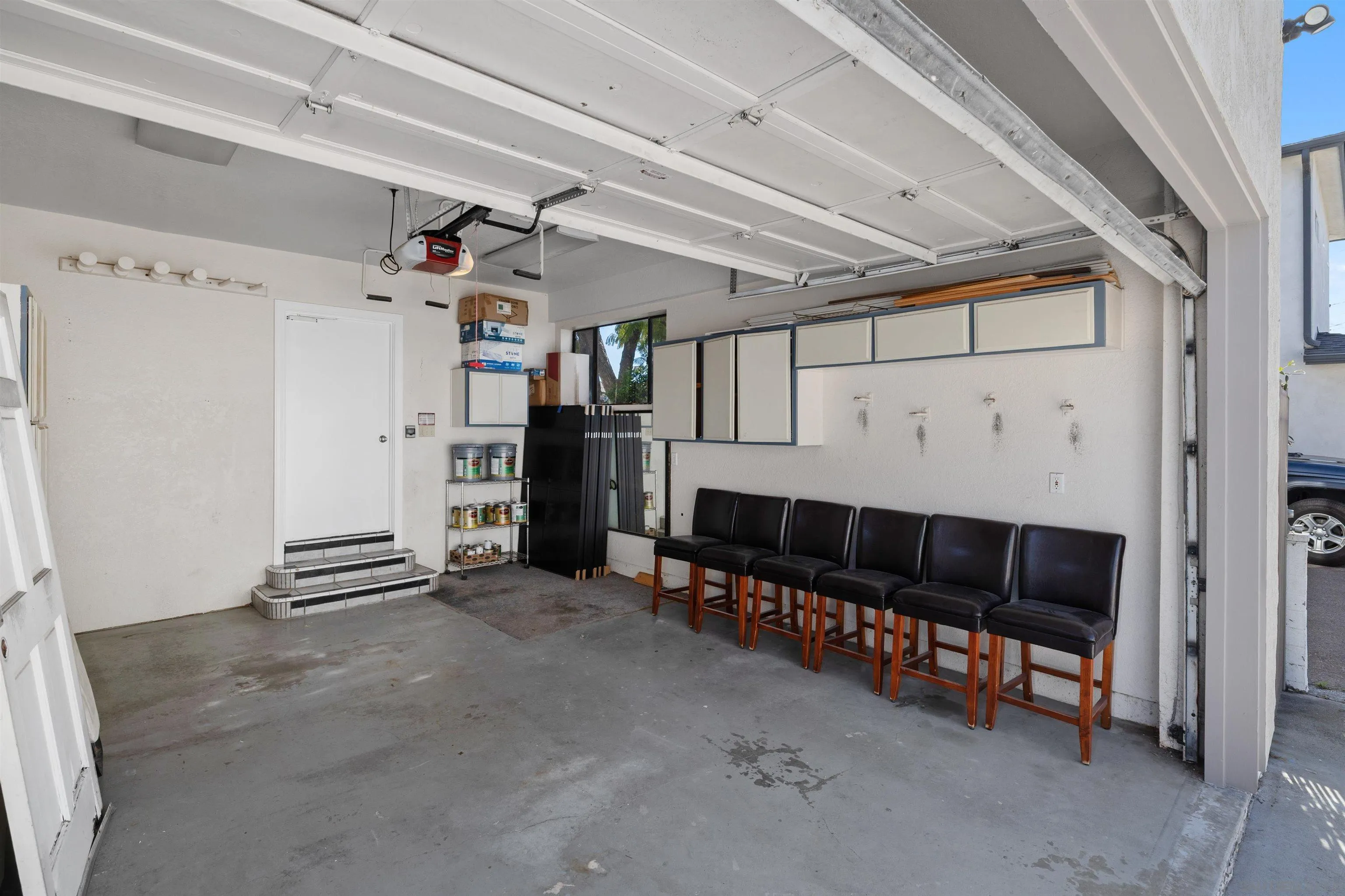 1564 Reed Avenue San Diego, CA 92109 - Photo 38 of 39 Spacious 2-car garage with ample storage for beach gear, bikes, and surfboards. Functional, organized space ideal for coastal living at 1564 Reed Ave, Pacific Beach, near beaches, parks, and outdoor recreation.