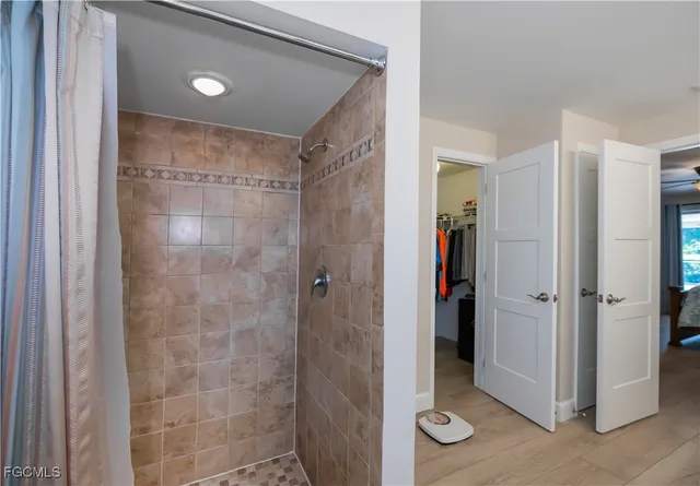a bathroom with a shower and a toilet