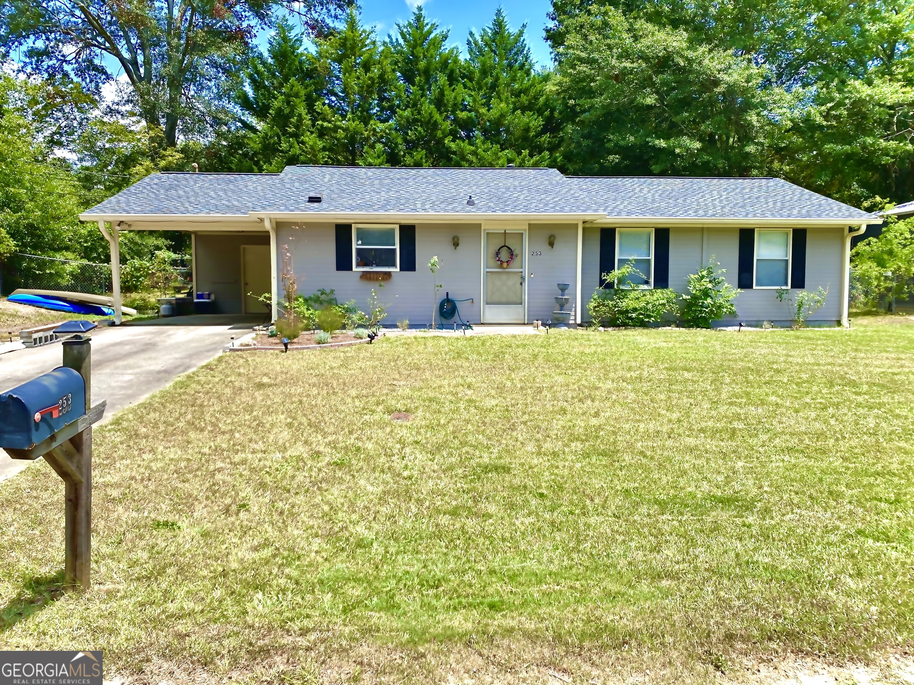 a front view of a house with a yard and porch