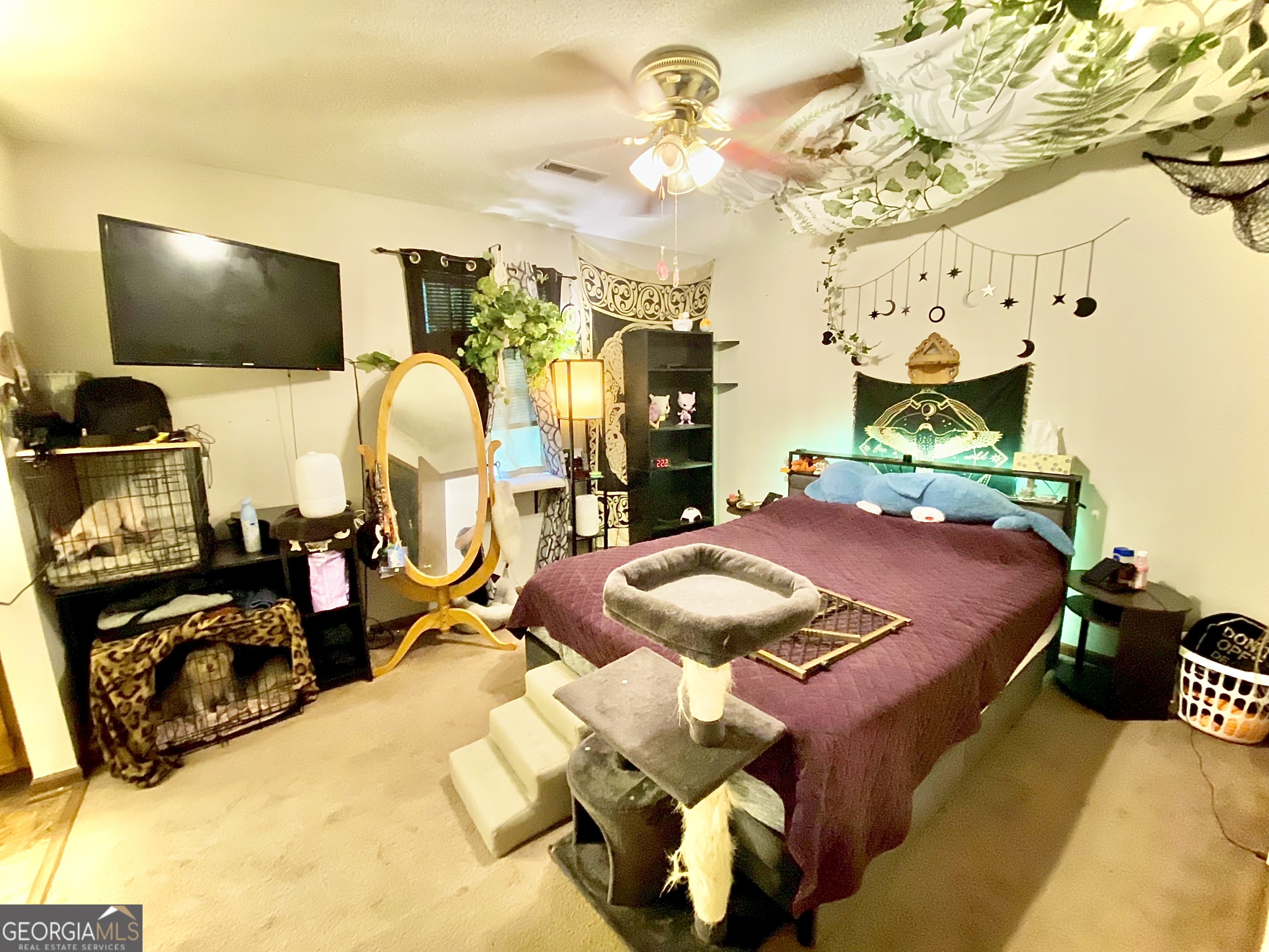 253 Stancil Drive Toccoa, GA 30577 - Photo 23 of 26 a bed room with a bed mirror and a flat tv screen on a table